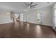 Expansive living area features hardwood floors, a decorative light fixture, large windows, and an open layout at 4140 Home Town Ln, Ravenel, SC 29470