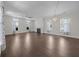 Spacious living room boasting hardwood floors, a fireplace, large windows, and stylish curtains at 4140 Home Town Ln, Ravenel, SC 29470