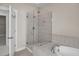 This bathroom features a shower with glass doors and a tile surround at 4140 Home Town Ln, Ravenel, SC 29470