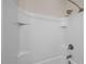 An all-white tile shower with storage cubbies and nickel fixtures at 4140 Home Town Ln, Ravenel, SC 29470