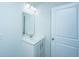 Bathroom featuring a white vanity with a mirror and modern fixtures plus a door at 431 Buckhannon Ln, Moncks Corner, SC 29461
