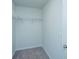 Small walk-in closet featuring wire shelving and neutral carpet at 431 Buckhannon Ln, Moncks Corner, SC 29461