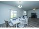 Cozy dining area with stylish chairs and a view to the backyard through the sliding glass door at 431 Buckhannon Ln, Moncks Corner, SC 29461