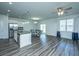 Bright dining area featuring a modern chandelier and ample natural light from the adjacent sliding door at 431 Buckhannon Ln, Moncks Corner, SC 29461