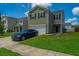 Charming two-story home with a manicured lawn and a driveway leading to an attached garage at 431 Buckhannon Ln, Moncks Corner, SC 29461