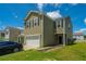 The exterior view of this home showcases a well-maintained lawn and an attached garage at 431 Buckhannon Ln, Moncks Corner, SC 29461