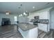 Modern kitchen with a granite island, stainless steel appliances, and sleek cabinetry at 431 Buckhannon Ln, Moncks Corner, SC 29461