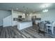 Modern kitchen with stainless steel appliances, granite countertops, and a large island for entertaining at 431 Buckhannon Ln, Moncks Corner, SC 29461