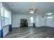 Inviting living room with large windows, neutral walls, and a ceiling fan for added comfort at 431 Buckhannon Ln, Moncks Corner, SC 29461