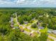 This aerial view showcases a suburban neighborhood filled with tree-lined streets and well-kept single Gathering homes at 439 Temple Rd, Ladson, SC 29456