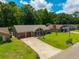 Lovely home with a well-kept lawn, long driveway, and mature trees, aerial perspective at 439 Temple Rd, Ladson, SC 29456
