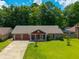 Beautiful home showcasing manicured lawn, mature trees, long driveway and desirable neighborhood at 439 Temple Rd, Ladson, SC 29456