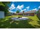 Well-manicured backyard featuring a patio and fire pit, ideal for outdoor entertaining at 439 Temple Rd, Ladson, SC 29456