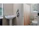 Cozy bathroom with pedestal sink, a large mirror, and shower in a separated area at 439 Temple Rd, Ladson, SC 29456