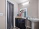 Cozy bathroom featuring a unique mirror, pedestal sink, cabinet storage, and a shower with curtain at 439 Temple Rd, Ladson, SC 29456