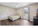 Bright bedroom with wood floors, large window view, and neutral tones, creating a serene space at 439 Temple Rd, Ladson, SC 29456