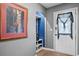 Inviting entryway featuring gray walls, security door, and a storage area with shelving at 439 Temple Rd, Ladson, SC 29456