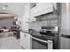 Modern kitchen with stainless steel appliances, stylish backsplash, and sleek countertops at 439 Temple Rd, Ladson, SC 29456