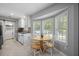 Bright eat-in kitchen with stainless steel sink, ample natural light and modern finishes at 439 Temple Rd, Ladson, SC 29456