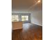 Open-concept space featuring modern flooring, large windows, and a functional kitchen island at 4669 Palm View Cir, North Charleston, SC 29418