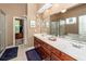 Bathroom featuring double sinks with a large mirror and vanity at 477 Commonwealth Rd, Mount Pleasant, SC 29466