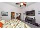 Spacious primary bedroom with mounted tv and ensuite bathroom entrance at 477 Commonwealth Rd, Mount Pleasant, SC 29466