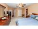 This bedroom features neutral walls, carpet, a ceiling fan, and access to a bathroom at 477 Commonwealth Rd, Mount Pleasant, SC 29466