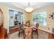 Cozy dining room with a glass table, decorative rug, and a glimpse into the foyer at 477 Commonwealth Rd, Mount Pleasant, SC 29466