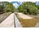 Wooden boardwalk overlooking scenic water leading to a community recreational area at 477 Commonwealth Rd, Mount Pleasant, SC 29466