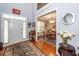 Elegant entryway with high ceilings, hardwood floors, and a view into the dining room at 477 Commonwealth Rd, Mount Pleasant, SC 29466