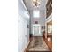Grand foyer with soaring ceilings, hardwood floors, and decorative accents at 477 Commonwealth Rd, Mount Pleasant, SC 29466