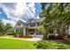Inviting two-story home showcasing a well-manicured lawn and classic architectural details at 477 Commonwealth Rd, Mount Pleasant, SC 29466