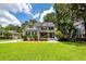 Beautiful two-story home with a lush green lawn, inviting front porch, and classic architectural details at 477 Commonwealth Rd, Mount Pleasant, SC 29466