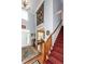 Grand foyer entrance with a tall ceiling, elegant staircase, and access to living spaces at 477 Commonwealth Rd, Mount Pleasant, SC 29466