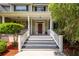 Inviting front porch with classic columns and a stylish entry door at 477 Commonwealth Rd, Mount Pleasant, SC 29466