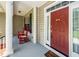 Cozy front porch with red rocking chairs, perfect for relaxing at 477 Commonwealth Rd, Mount Pleasant, SC 29466