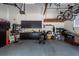 Organized garage featuring cabinets, storage racks, and ample space for parking at 477 Commonwealth Rd, Mount Pleasant, SC 29466