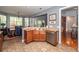 Kitchen with stainless appliances, wood cabinetry, and seamless layout adjacent to the dining area at 477 Commonwealth Rd, Mount Pleasant, SC 29466