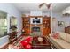 Inviting living room featuring built-in shelves, a cozy fireplace and comfortable seating for entertaining at 477 Commonwealth Rd, Mount Pleasant, SC 29466