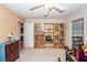 This living room features a ceiling fan, carpet, and built in bookcases at 477 Commonwealth Rd, Mount Pleasant, SC 29466