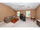 This living room has a vaulted ceiling, ceiling fan, and ample seating at 477 Commonwealth Rd, Mount Pleasant, SC 29466