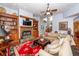 Spacious living room with a fireplace, custom built-ins, hardwood floors and comfortable seating arrangement at 477 Commonwealth Rd, Mount Pleasant, SC 29466
