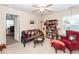 Inviting living room with comfortable seating, including a sofa and armchair, plus bookshelves at 477 Commonwealth Rd, Mount Pleasant, SC 29466