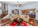 Cozy living room featuring hardwood floors, a ceiling fan, and comfortable seating, great for entertaining at 477 Commonwealth Rd, Mount Pleasant, SC 29466
