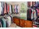 Walk-in closet with custom shelving and storage solutions, ensuring organization and style at 477 Commonwealth Rd, Mount Pleasant, SC 29466