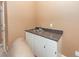 This wet bar features cabinets, a granite counter top, and a stainless steel sink at 477 Commonwealth Rd, Mount Pleasant, SC 29466