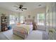 Inviting bedroom with multiple windows, a ceiling fan, playful decor, and a comfortable bed at 480 Longleaf Dr, Walterboro, SC 29488