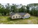 Inviting yellow home features a side-entry garage and lush green surroundings at 480 Longleaf Dr, Walterboro, SC 29488