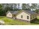 Exterior view of a yellow home, highlighted by the new roof and vinyl siding at 480 Longleaf Dr, Walterboro, SC 29488