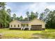 Yellow home showcasing the side-entry garage and covered front porch at 480 Longleaf Dr, Walterboro, SC 29488